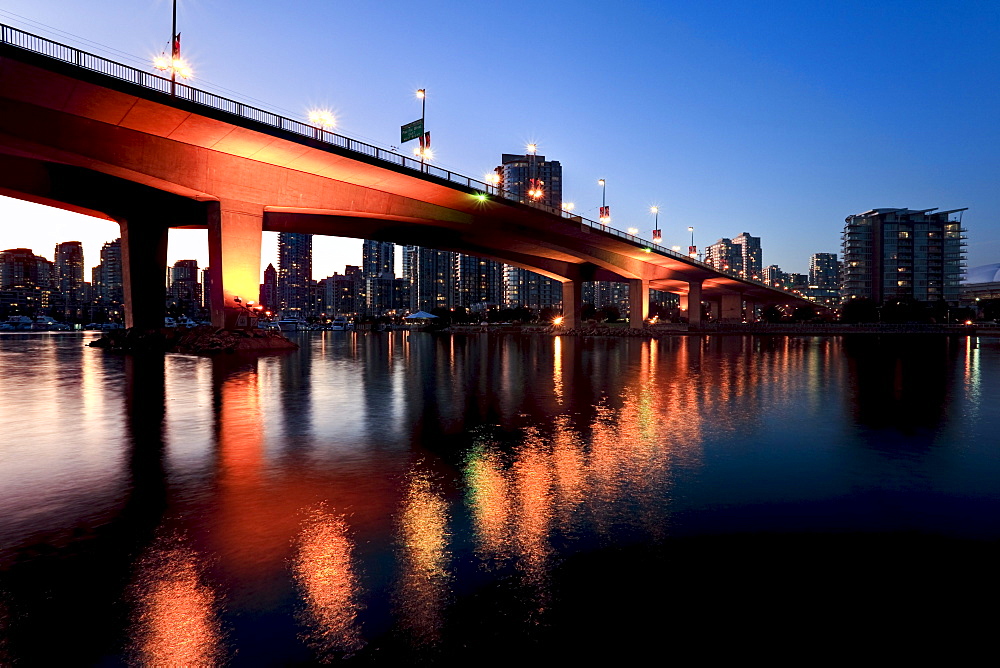 View under Cambie Street Bridge from False Creek to condominiums of Yaletown, Vancouver, British Columbia