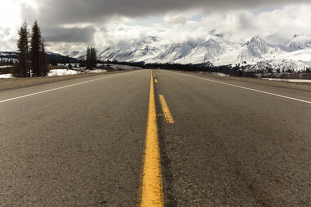 Haines Highway and snow-covered peaks of St. Elias Range in distance, Northern British Columbia