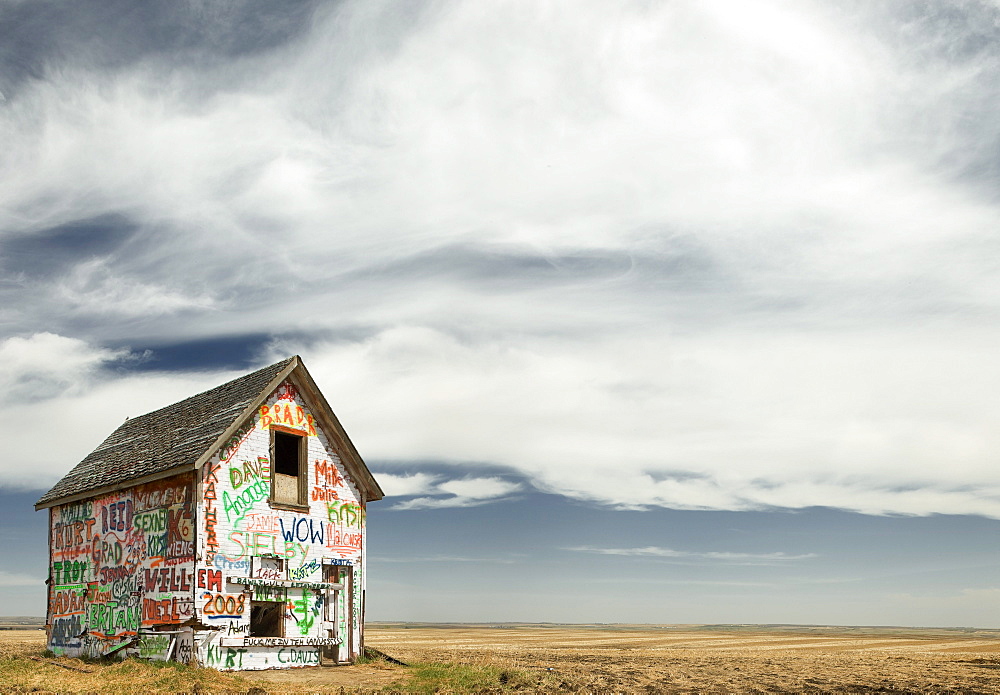 Graffiti covered abandoned shed near Linden, Alberta