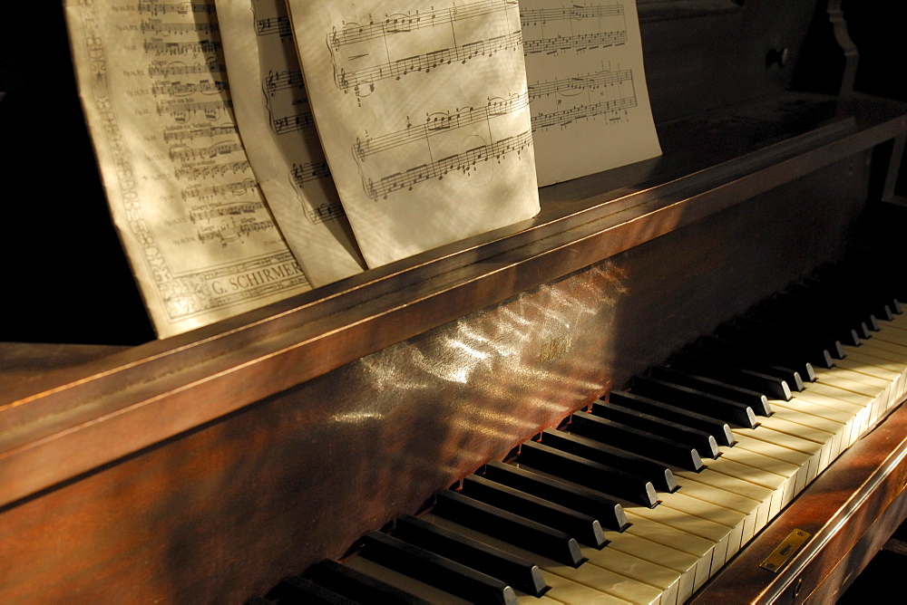 Piano and sheet music in window light, John Walter Museum, Edmonton, Alberta