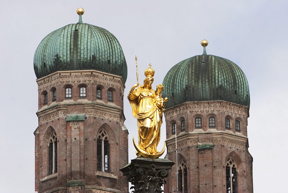 Statue of the Virgin Mary at the Marienplatz with the Frauenkirche in the background, Munich, Bavaria, Germany