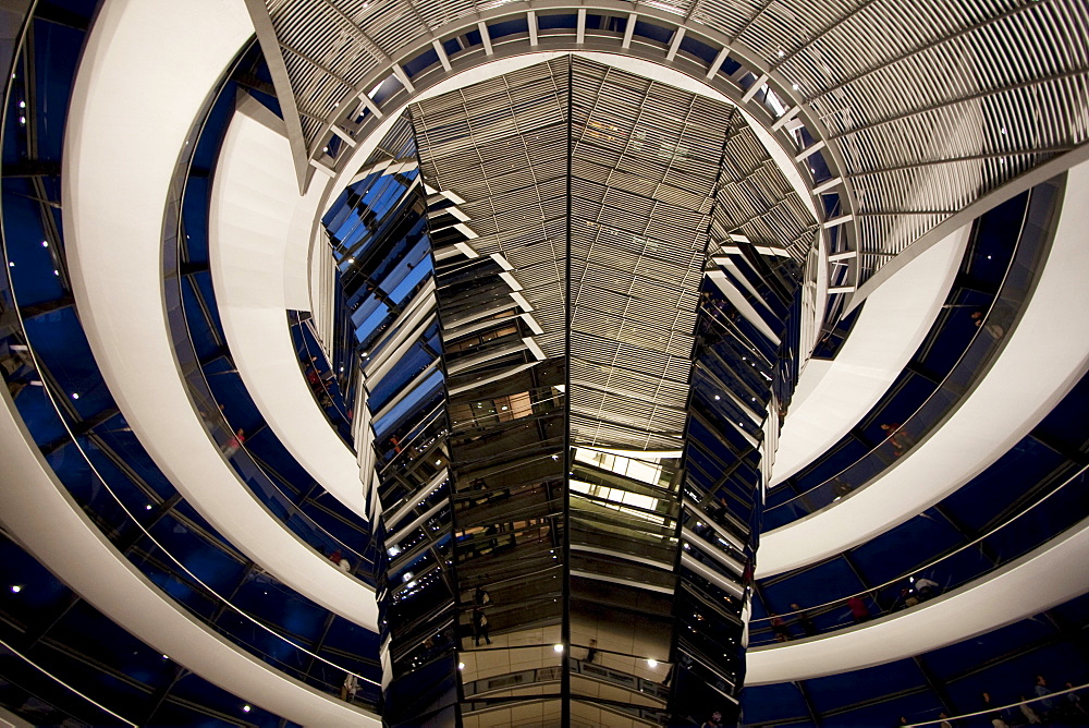 Inside Norman Foster's Dome of the Reichstag Building at night, Berlin, Germany