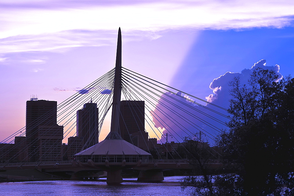 Winnipeg skyline and Esplanade Riel Bridge, from Red River at sunset, Winnipeg, Manitoba