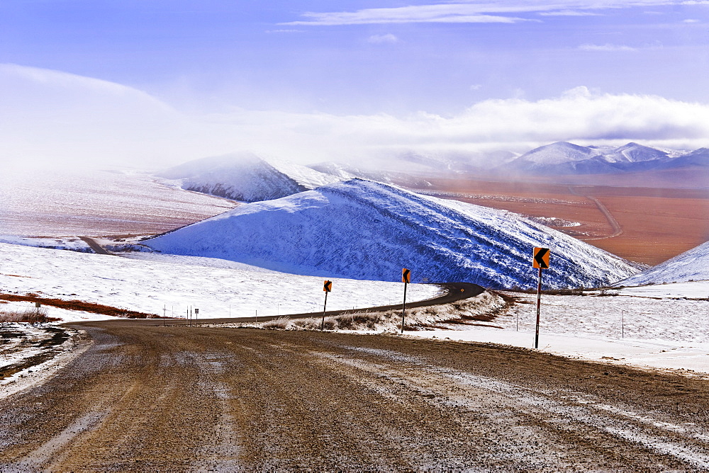 Snow along Dempster Highway and fog over Richardson Mountains, Yukon