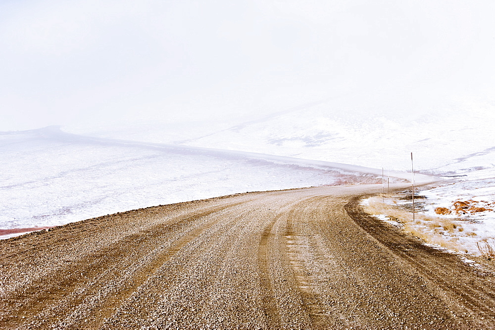 Snow along Dempster Highway and fog over Richardson Mountains, Yukon