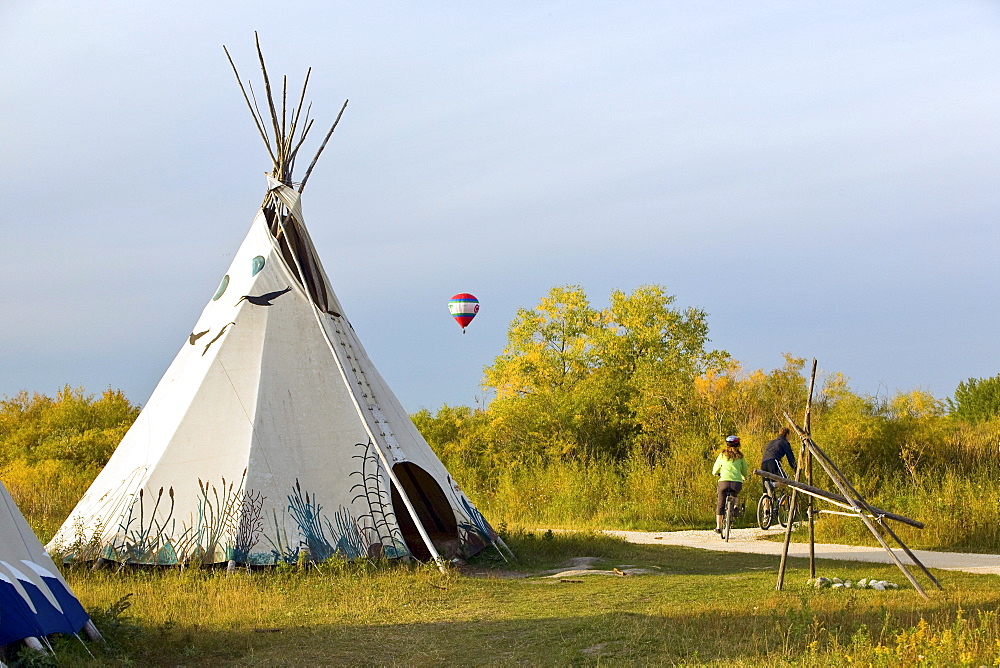 Fort Whyte Centre for Environmental Education with a hot air balloon in background, Winnipeg, Manitoba