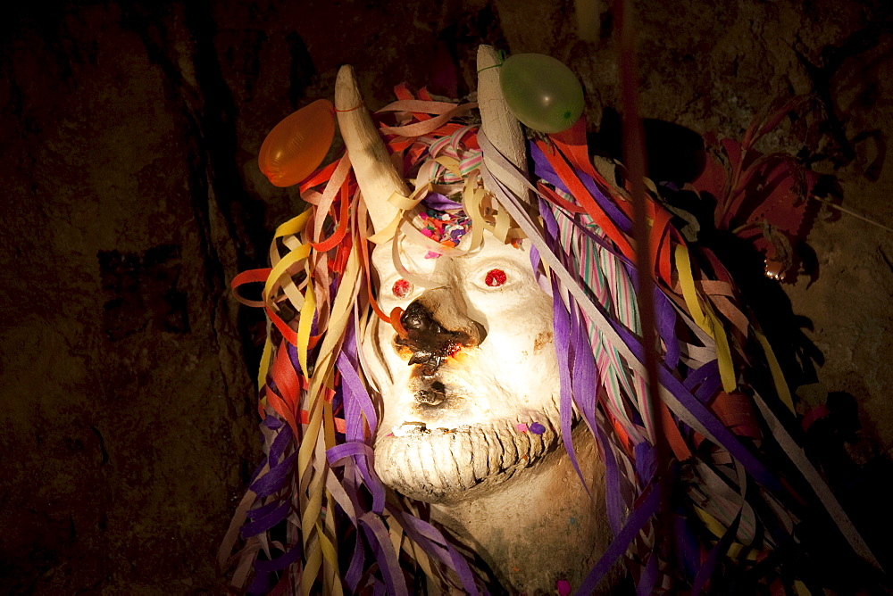 Ceramic figure of el Tio or Supai, a creature with horns, gleaming eyes and a big penis, that in fact is not really satanic. It was introduced by the Spaniards in the 16th Century to the mines of Potosi. According to tradition, el Tio (The Uncle) rules over the mines of Cerro Rico, simultaneously offering protection and destruction. Over 500 chambers with statues to honour him have been constructed in Cerro Rico, so miners can leave offerings of tobacco, liquor and coca leaves to invoke his goodwill and protection., Potosi Department, Bolivia