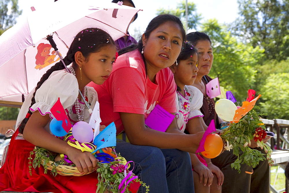 Women and girls watching the Entrada de Comadritas parade during the Carnaval Chapaco, Tarija, Bolivia