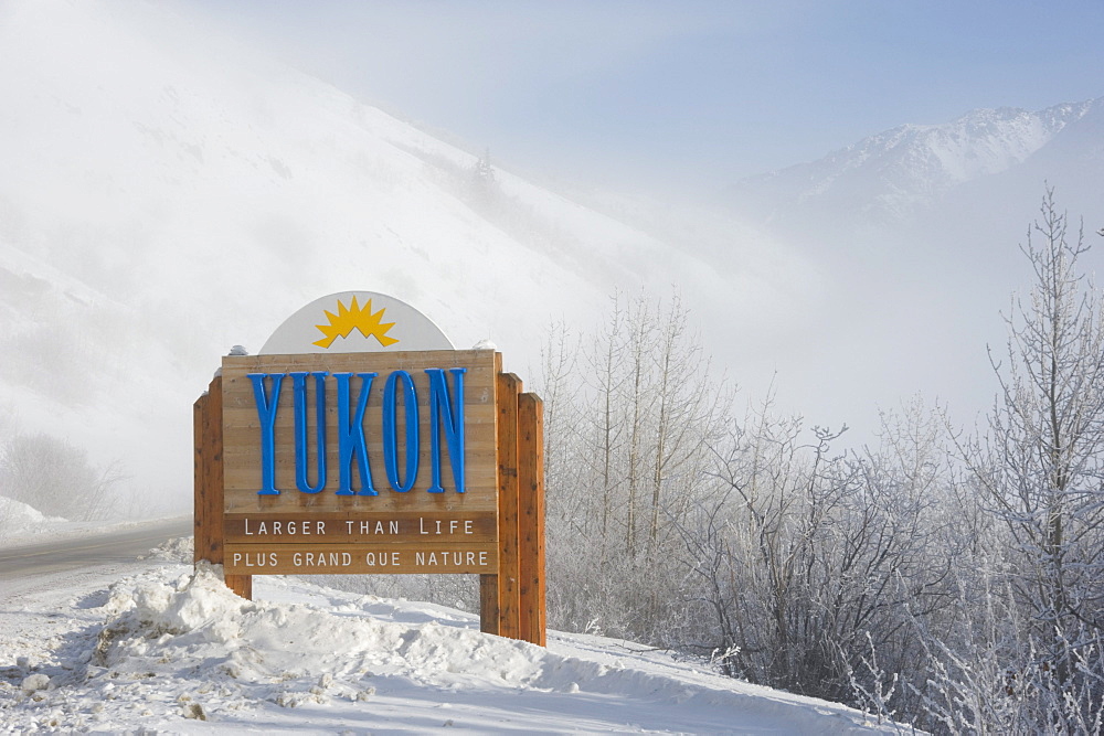 Mid-winter image of Welcome sign on Yukon, British Columbia border