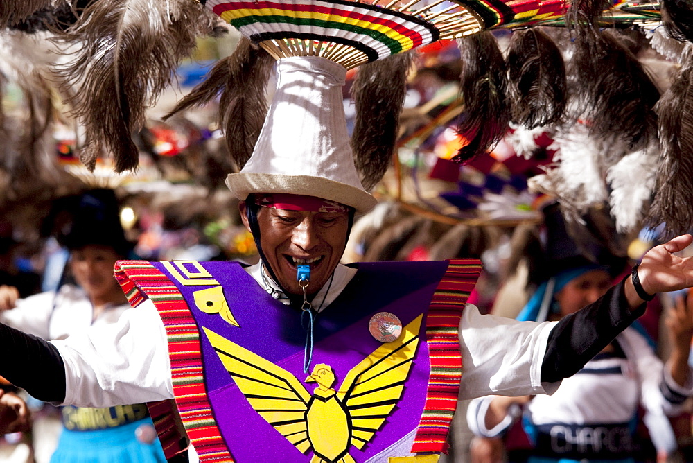 Suri Sicuri dancer wearing an elaborate feather headdress in the procession of the Carnaval de Oruro, Oruro, Bolivia