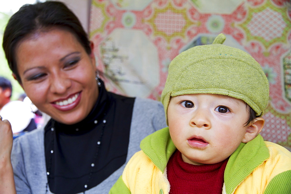 Woman and boy at the Alasitas Fair, La Paz, Bolivia