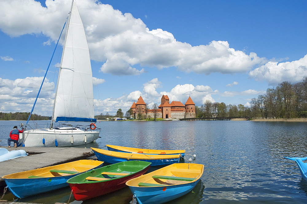 Sail boats on Galve Lake with the Island Castle in the background -Trakai, Lithuania