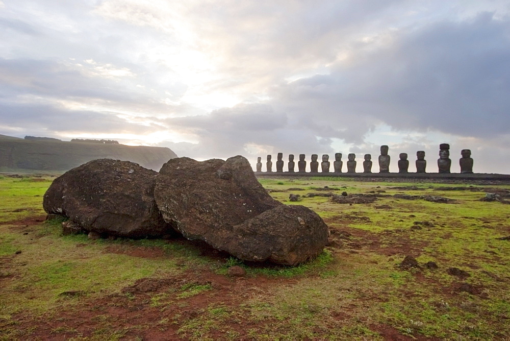 Fallen moai & fifteen moais from different periods, restored by archaeologist Claudio Cristino, at Ahu Tongariki at dawn, Rapa Nui (Easter Island), Chile