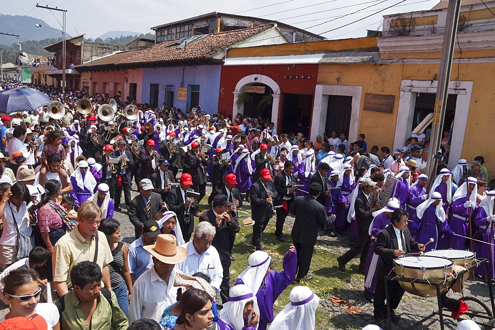 A music band plays funeral marches during the Procession of the Holy Cross on Good Friday in Antigua Guatemala, Sacatepuquez, Guatemala