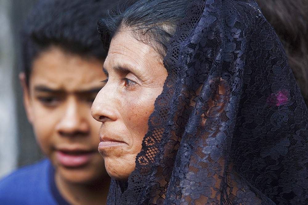 Woman dressed in mourning at the Holy Burial Procession on Good Friday in Antigua Guatemala, Sacatepuquez, Guatemala