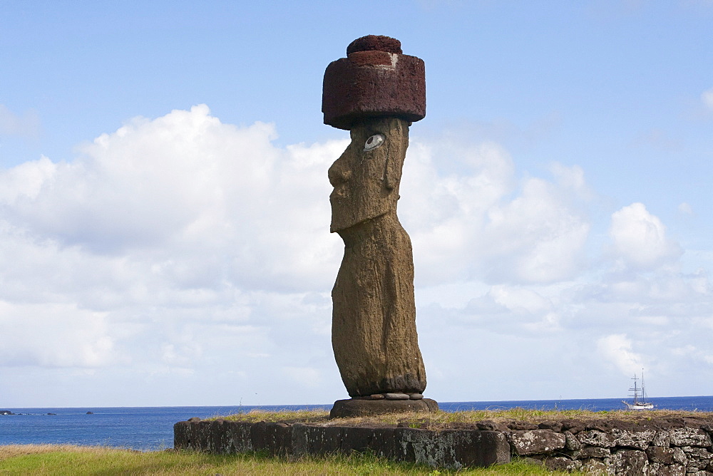 The moai of Ahu Ko te Riku at the Tahai Ceremonial Complex statue, restored by William Mulloy is the only statue to feature inlaid eyes. Hubert Herzog and Tony Saulnier had the pukao (top knot) cut and put in place, Rapa Nui (Easter Island), Chile