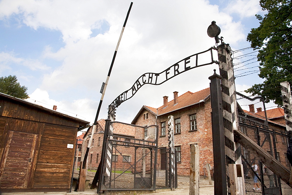 Main gate with the 'Arbeit macht frei' slogan over it, Auschwitz Concentration Camp, Oswiecim, Malopolska, Poland