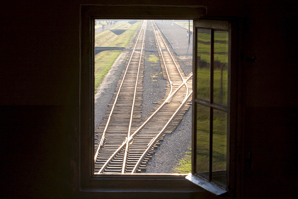 View of the railway track along the 'Selektionsrampe', the platform where people where selected to die in the gas chambers immediately or to work to death from the main guard house (Gate of Death), Auschwitz-Birkenau Concentration Camp, Oswiecim, Malopolska, Poland