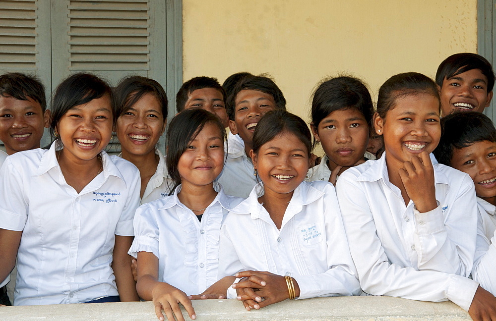 South East Asia, Cambodia, Siem Reap, A group of young school children gather for a class photo.