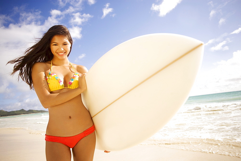 Hawaii, Oahu, Surfer girl enjoying a day out.