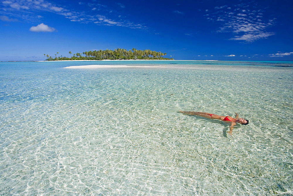 French Polynesia, Tahiti, Rangiroa, Woman floating in water.