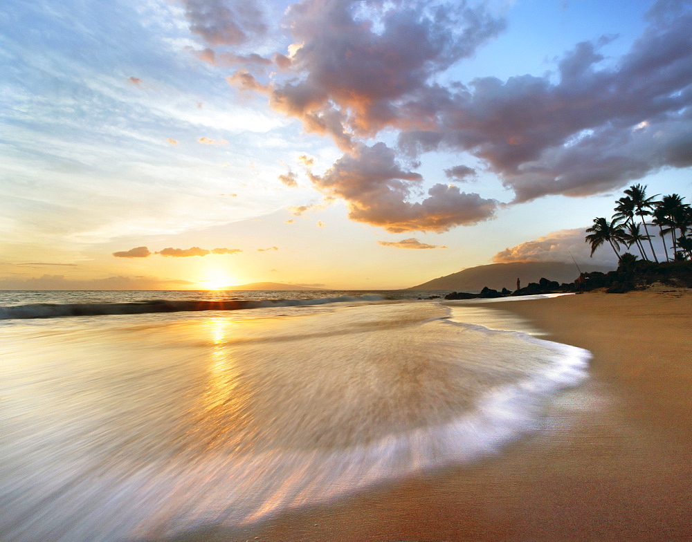 Hawaii, Maui, Makena, Secret Beach at sunset.