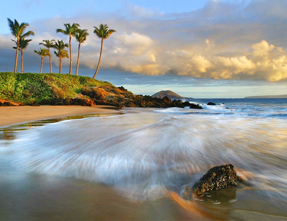 Hawaii, Maui, Makena, Secret Beach at sunset.