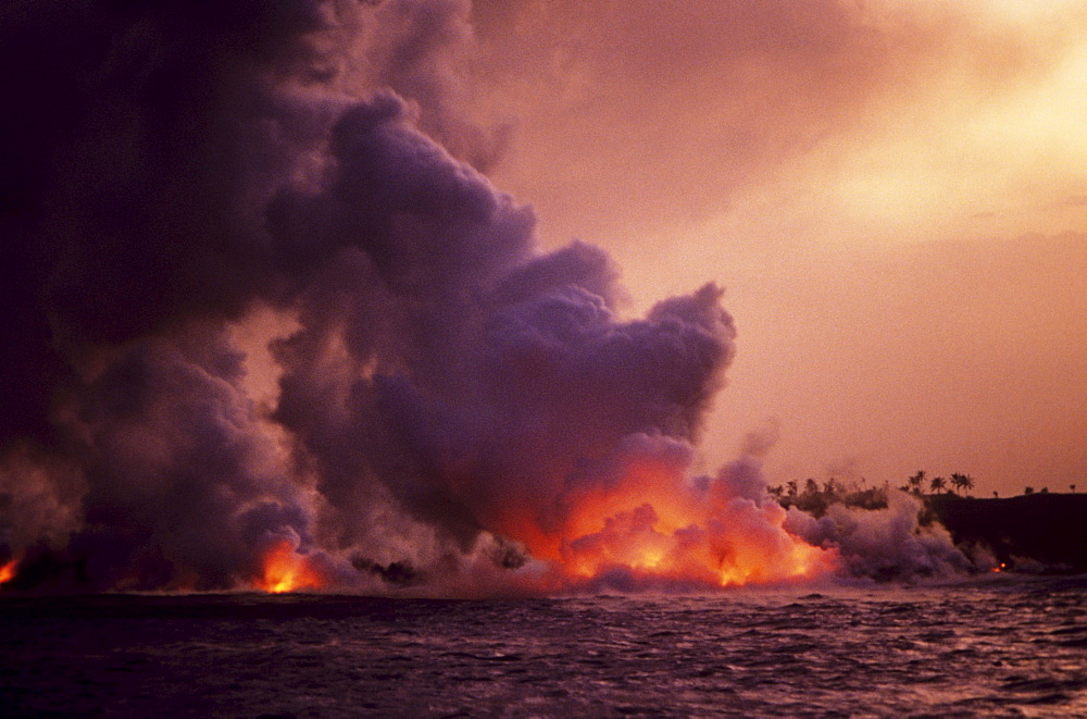 Hawaii, Big Island, Hawaii Volcanoes National Park, Molten Lava from Kilauea flowing into ocean.