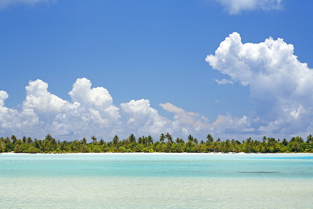 French Polynesia, Tahiti, Maupiti, lagoon, island with bright blue sky.