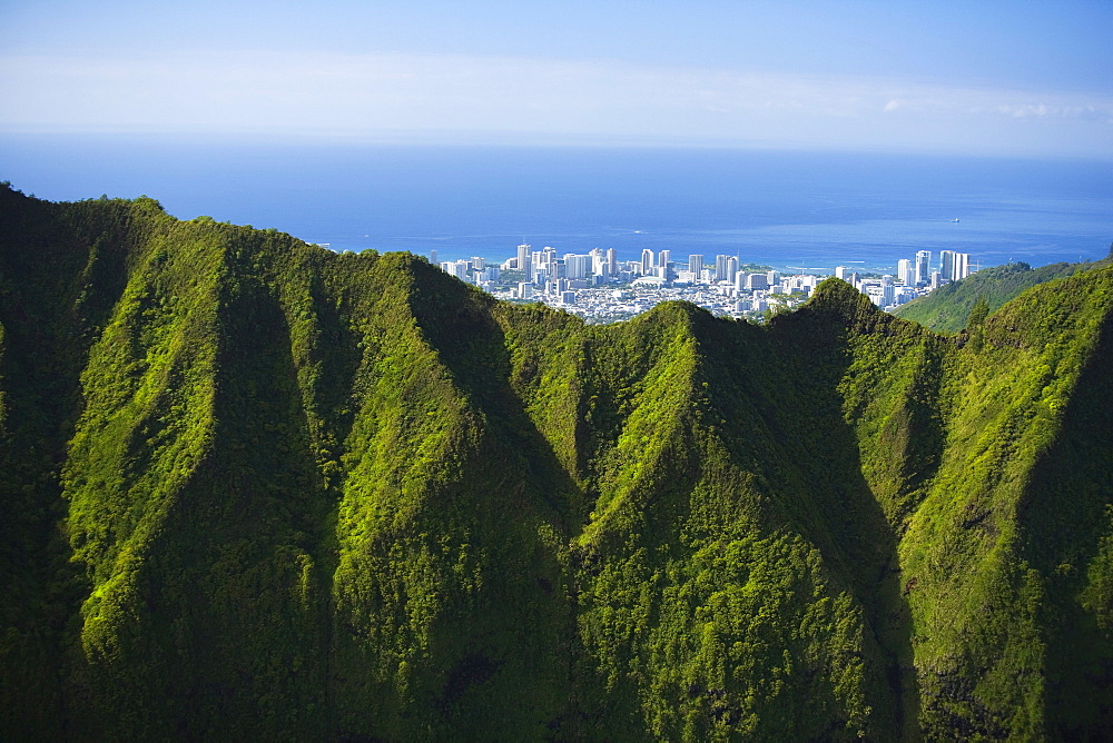 Hawaii, Oahu, Aerial of Honolulu overlooking the Koolau Mountains.