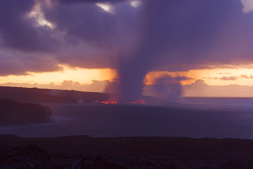 Hawaii, Big Island, Kalapana, Steam cloud formed by lava entering Pacific Ocean from Kilauea.