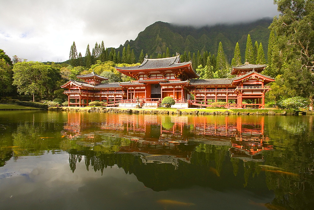 Hawaii, Oahu, Ahuimanu Valley, Valley of the Temples, Byodo-In Temple, Koi swimming in pond.