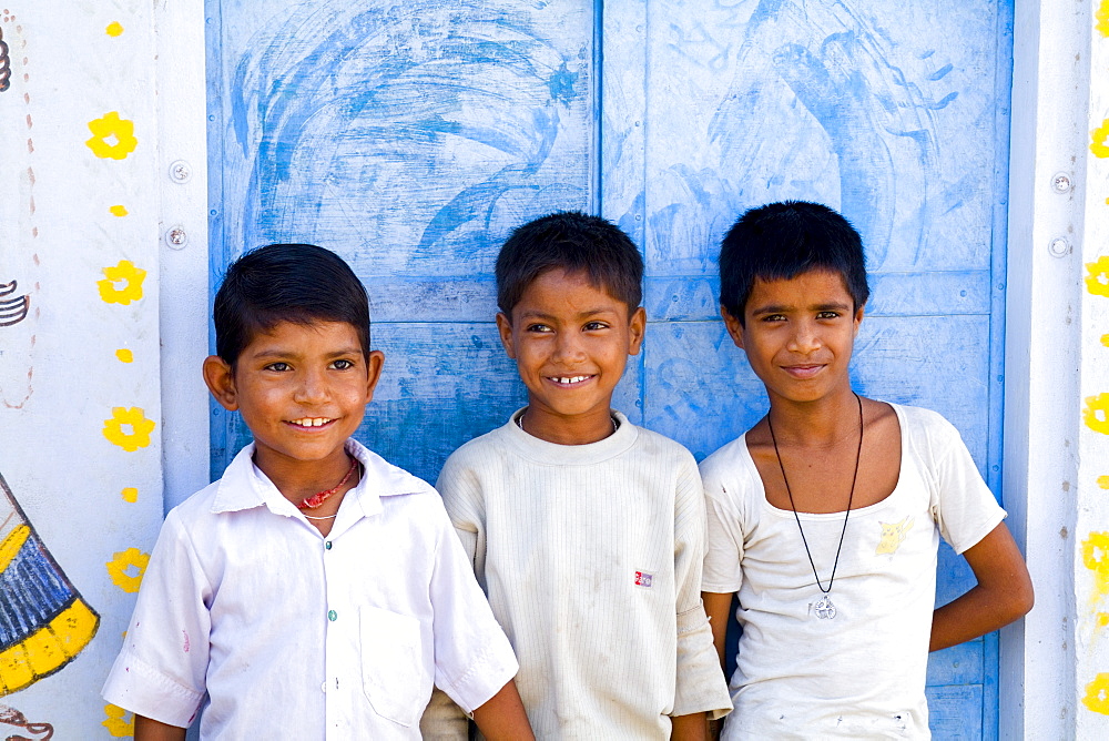 India, Rajasthan, Jaipur, three young local boys.