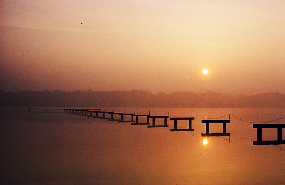 New Jersey, Cape May, Sunrise over inland waterway, Reflections in smooth water.