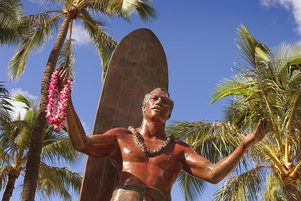 Hawaii, Oahu, Waikiki, Duke Kahanamoku statue in front of Kuhio Beach Park.