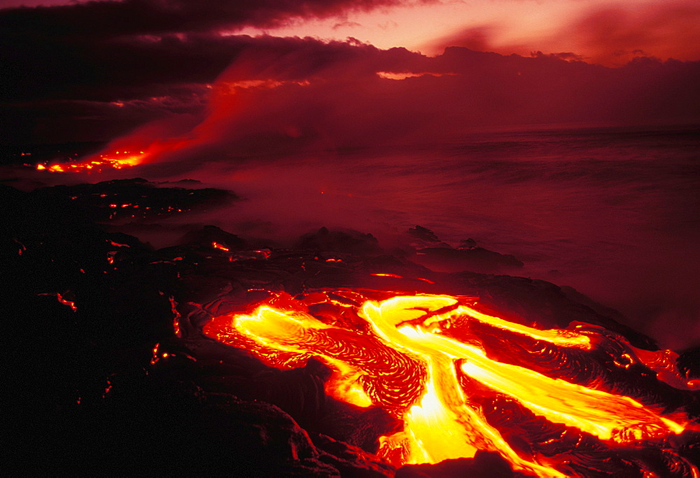 Hawaii, Big Island, Hawaii Volcanoes National Park, lava flow glows in early dawn