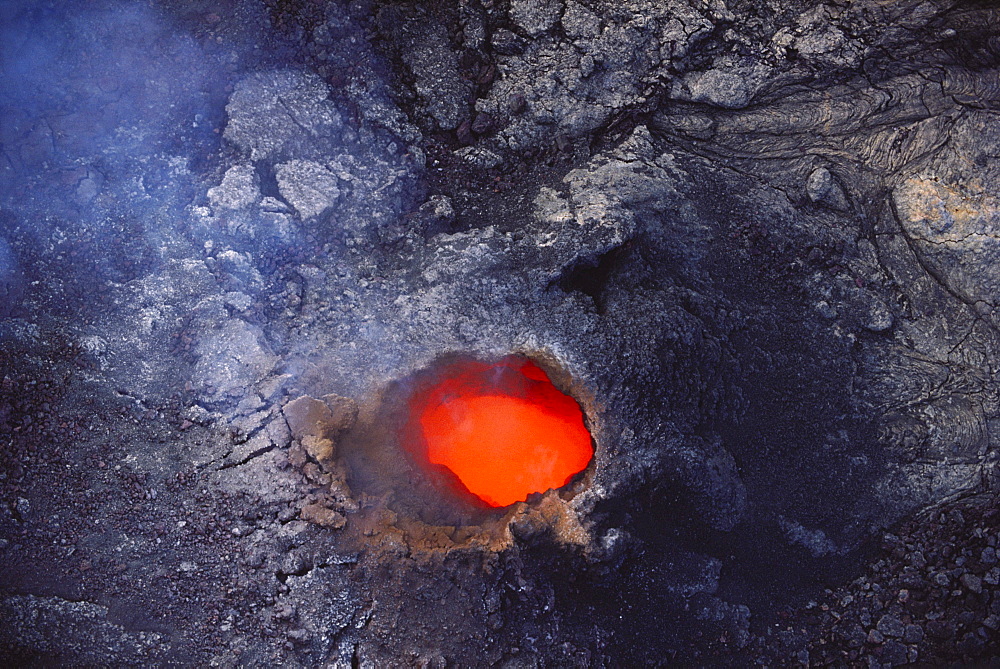 Hawaii, Big Island, Hawaii Volcanoes National Park, Molten lava seen through hole in lava tube.