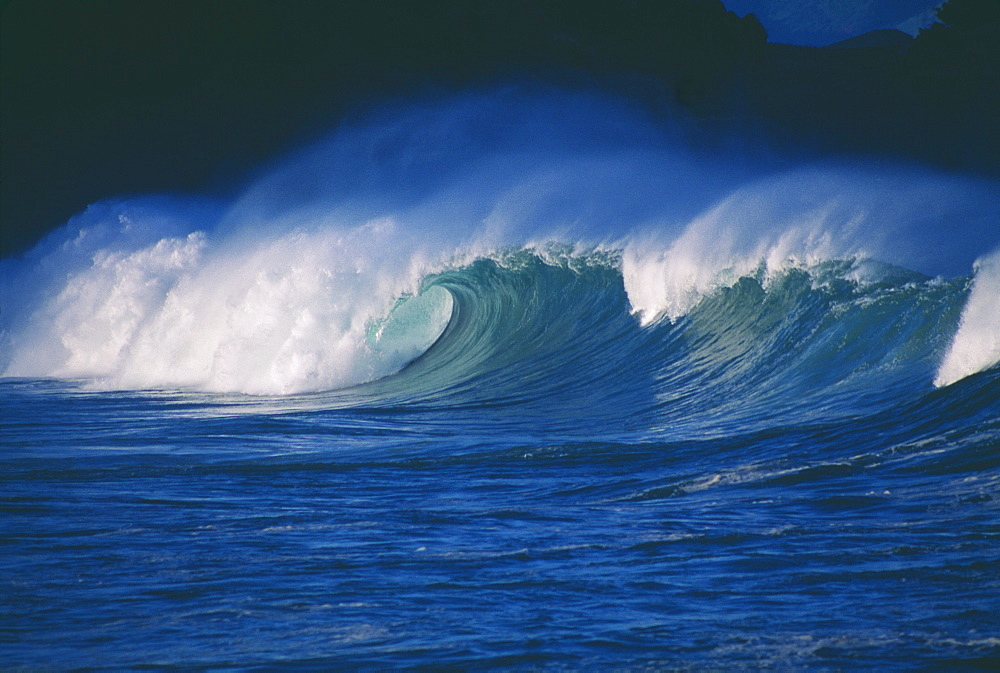 Hawaii, Waves crash in the morning light.