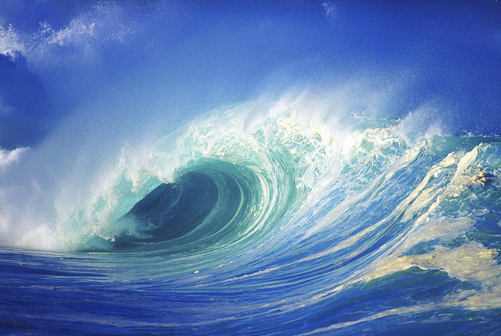 Stormy ocean wave curling over with whitewash, view of barrel, closeup