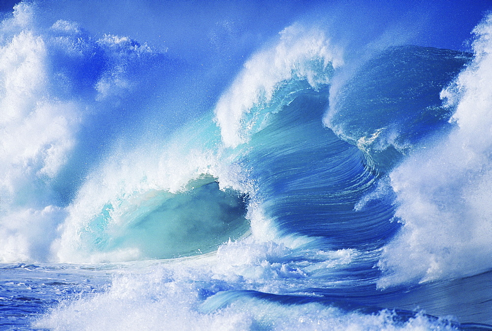 Hawaii, Oahu, North Shore; several green waves crashing in layers white wash