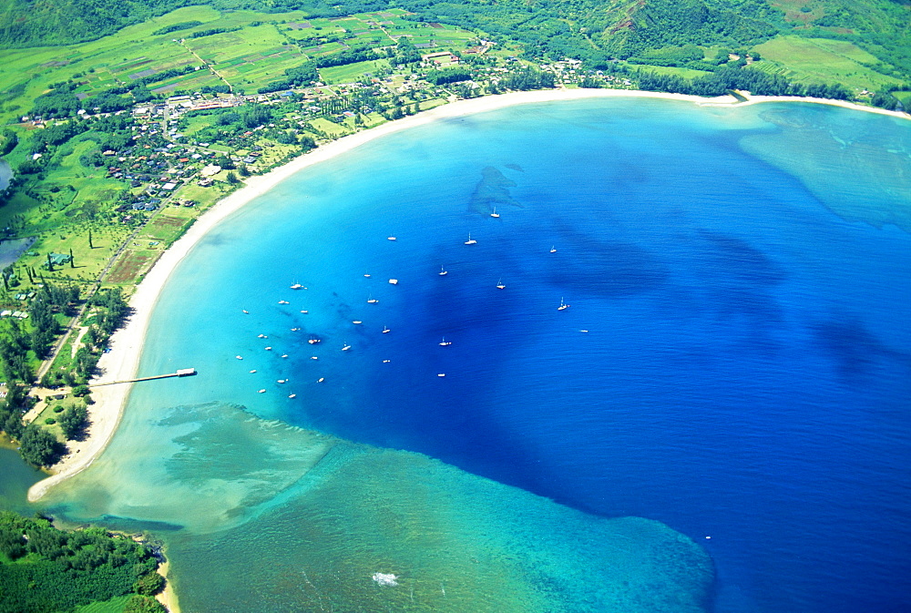 Hawaii, Kauai, aerial of  Hanalei Bay, boats in ocean