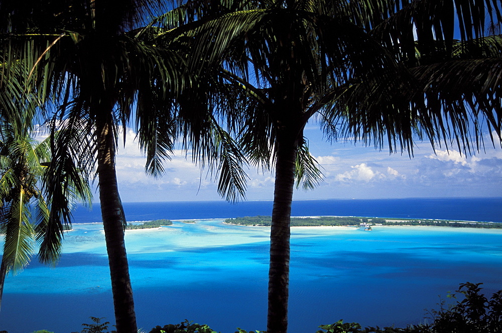 French Polynesia, Bora Bora, View from shore of lagoon and sand islands in distance.