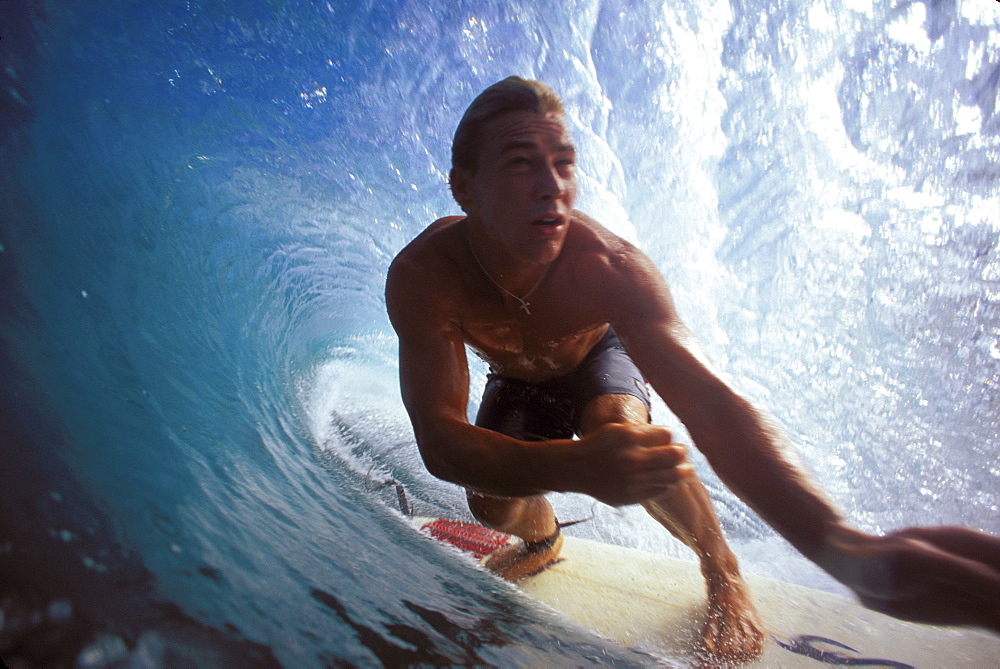 Hawaii, Oahu, North Shore, Pipeline, Pancho Sullivan surfs pipeline, in the tube, arms front