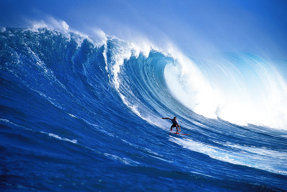 Hawaii, Maui, Peahi, Buzzy Kerbox surfing big wave curling and crashing behind