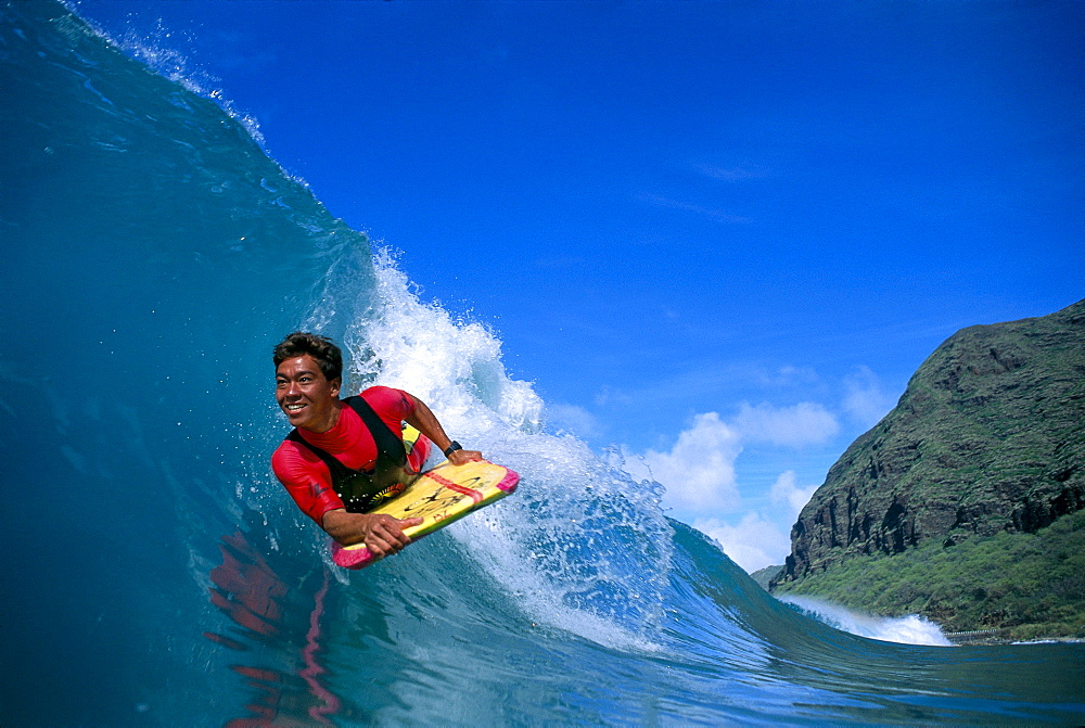 Hawaii, Body boarder Danny Kim smiling, close-up front angle, colorful 