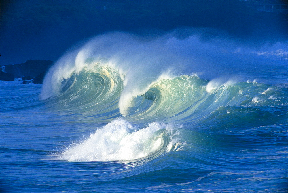 Big stormy waves with white caps curling, Waimea shore break 