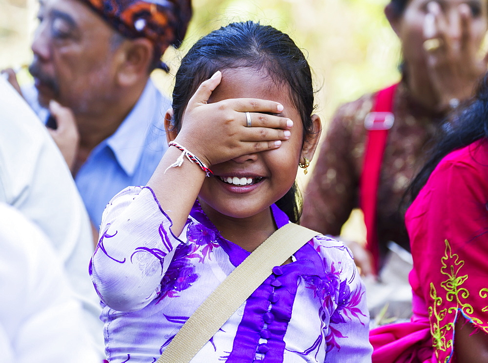 Girl at a Ngaben or Cremation Ceremony, Klungkung, Bali, Indonesia