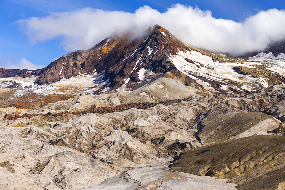 Trident Volcano rises above the rugged ash-covered Knife Creek Glaciers in Katmai National Park; Alaska, United States of America