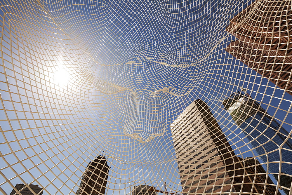 Calgary Skyline Viewed Through The Wonderland Sculpture; Calgary, Alberta, Canada