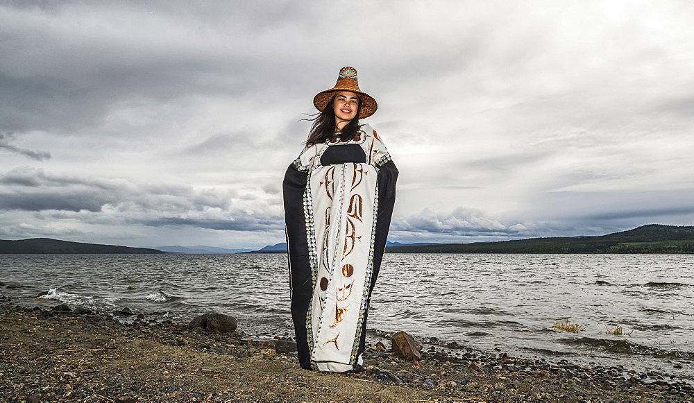 Tlingit first nation woman in traditional wardrobe on the shores of Teslin Lake, Teslin, Yukon, Canada